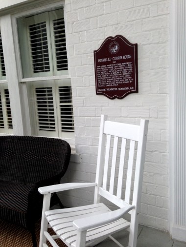 A plaque marks the home's historic status.