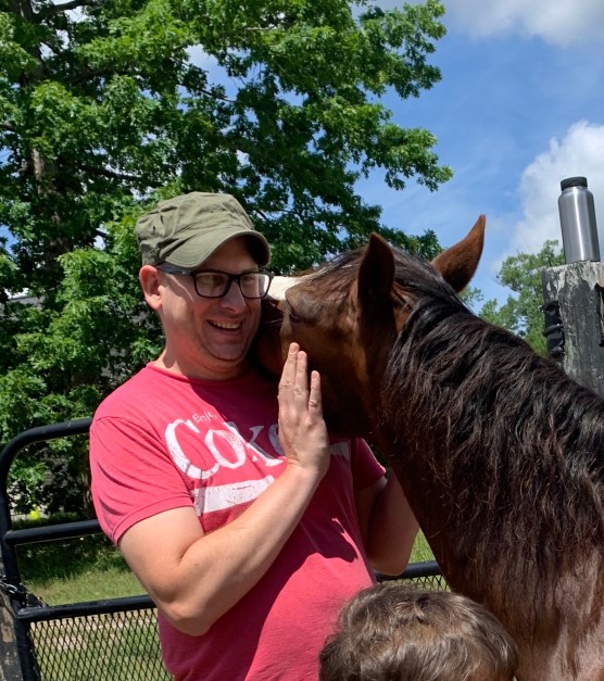 cuddling with a horse